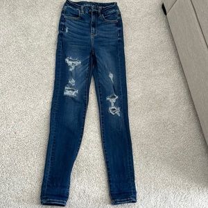 american eagle high rise jeans, size is 00, with rips.